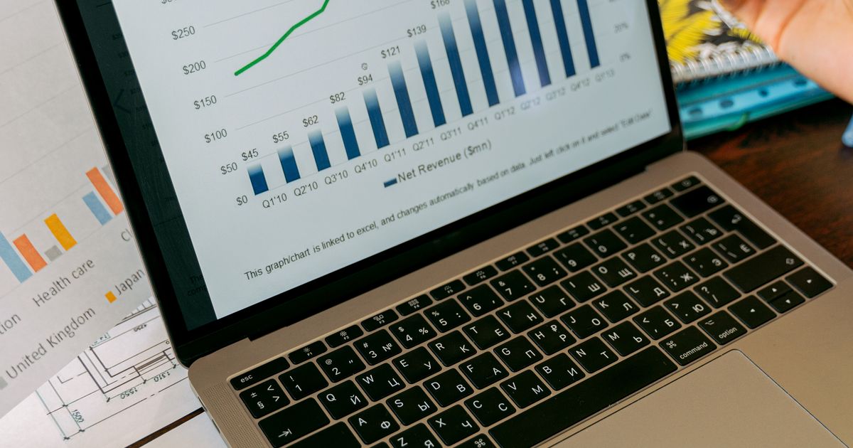 Laptop screen displaying statistical charts and results.
